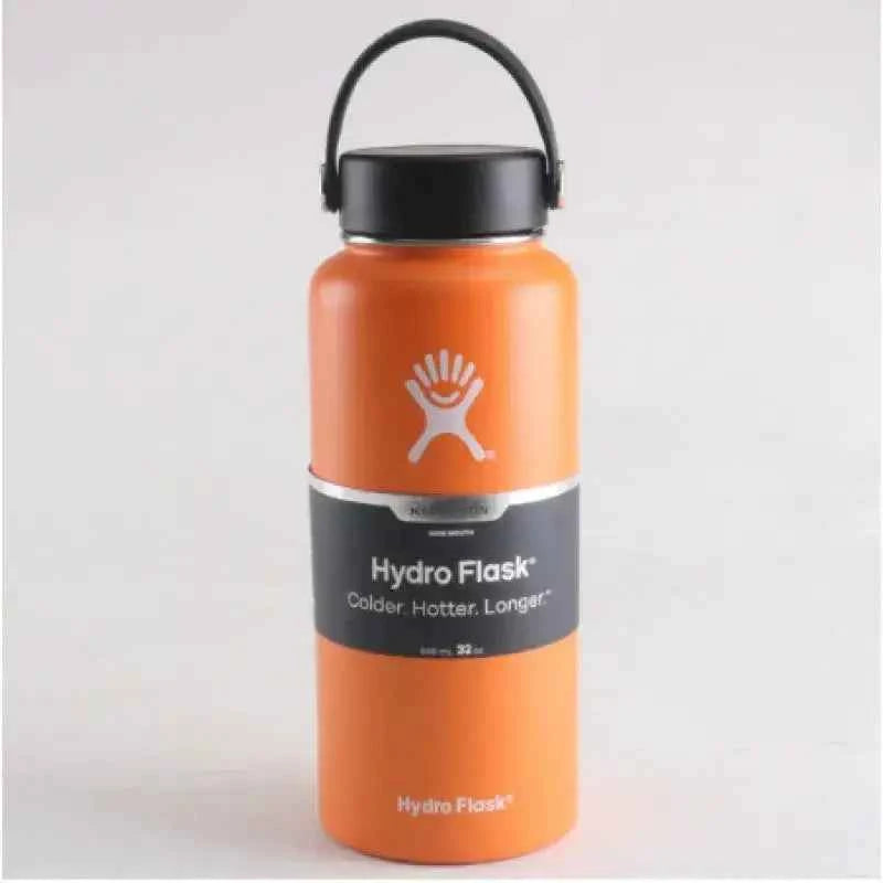 32oz Hydro Flask insulated water bottle in orange with flex carry handle lid for camping hiking and outdoor adventures