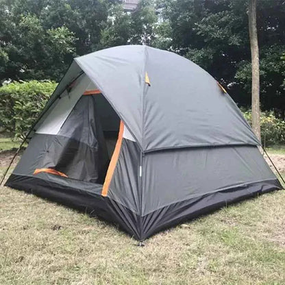 Lightweight 3-person camping tent set up outdoors on grass, featuring a dome design with rainfly and mesh door for ventilation.
