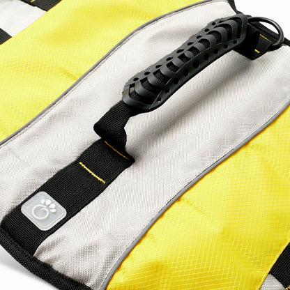 Close-up of reinforced top handle on yellow dog life jacket for secure lifting and control