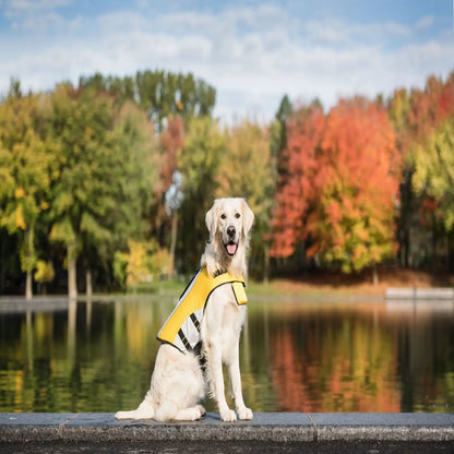 Dog wearing a yellow life jacket while hiking near a lake, designed for outdoor adventures and water safety