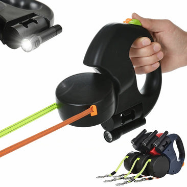 Hand holding a retractable dog leash with built-in LED flashlight, ergonomic handle, and reflective leash cord for nighttime walking